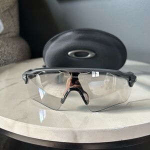 Oakley Black sunglasses with photochromic lenses.